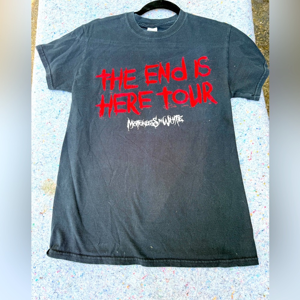 Motionless in white band shirt